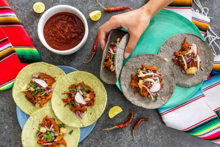 hand-holding-a-mexican-pork-taco.jpg